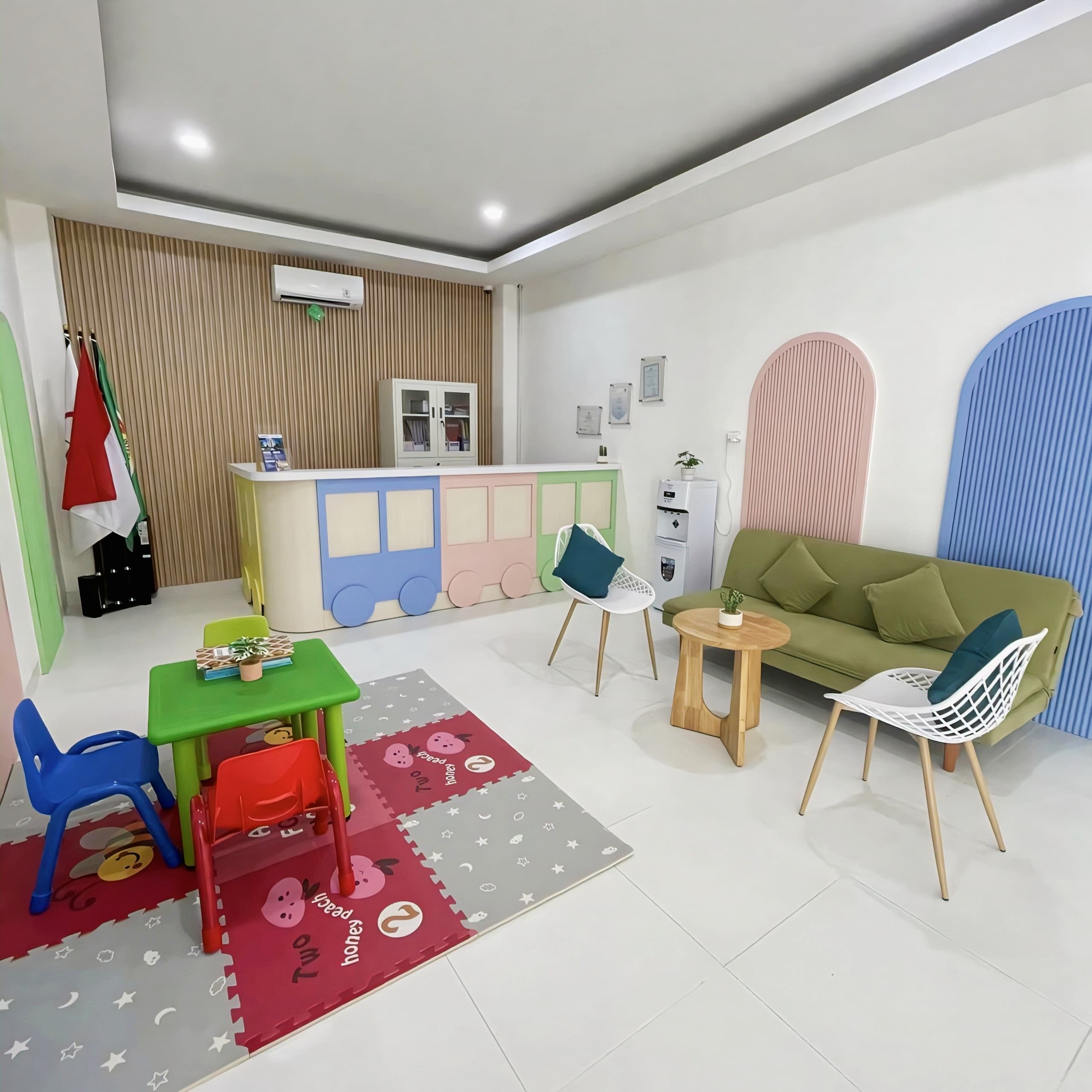 CRS Room reception and waiting lounge with a train-themed front desk