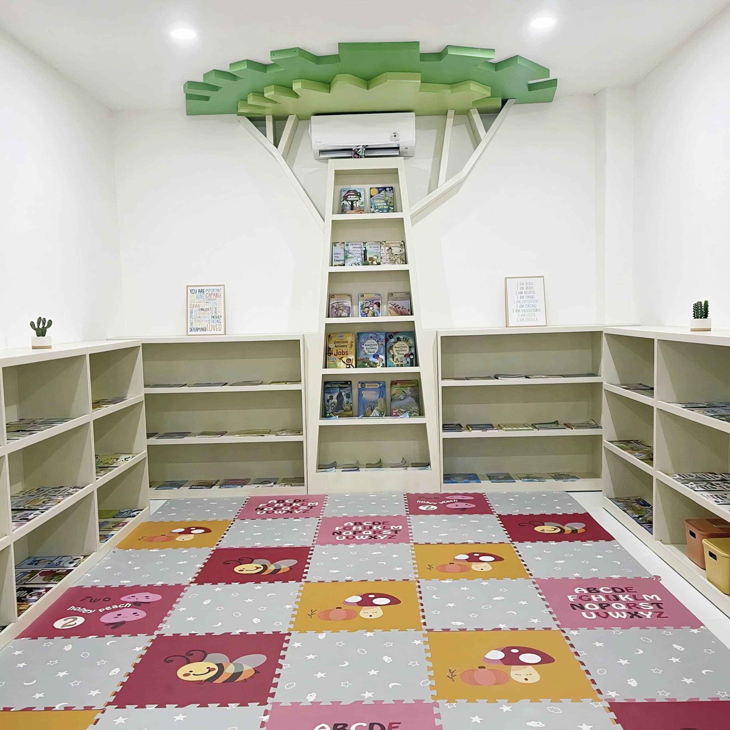 Library with a tree-shaped bookshelf and colourful reading rug