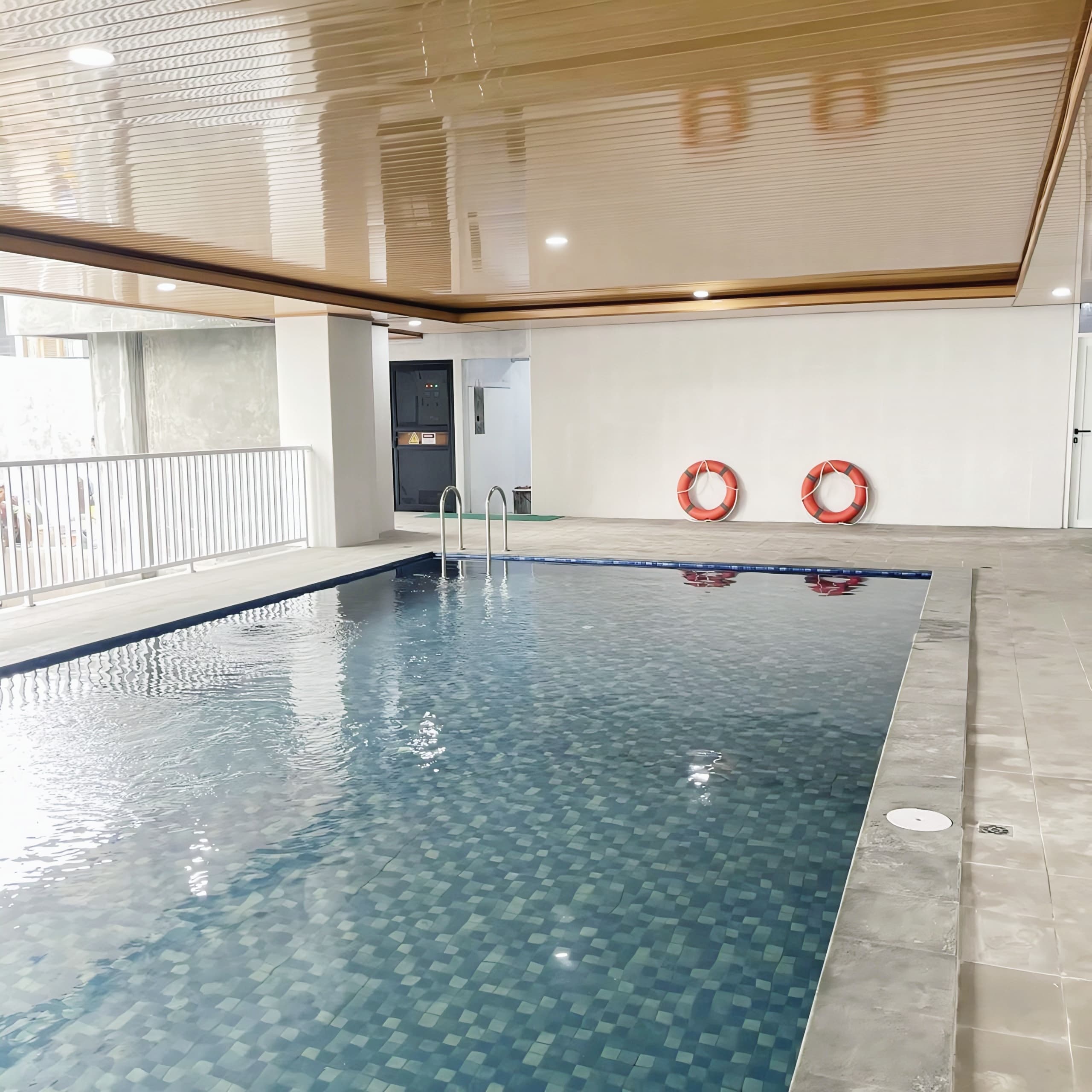 Indoor swimming pool with life rings on the wall